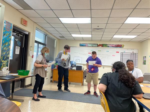 image of students and teachers at the start of the work day