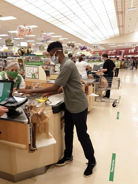 Image of Student bagging Groceries at a local store